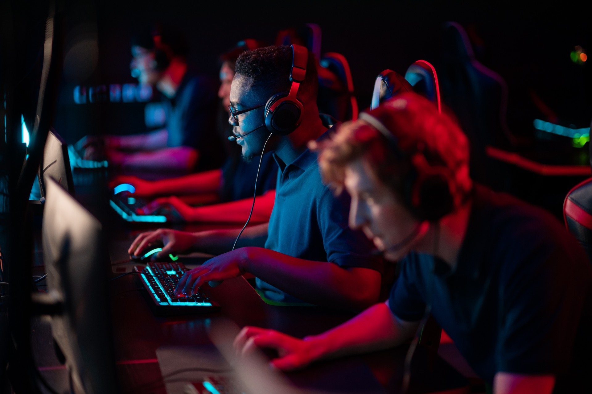 Professional esports players at an online game tournament. The cyber team plays computers and trains